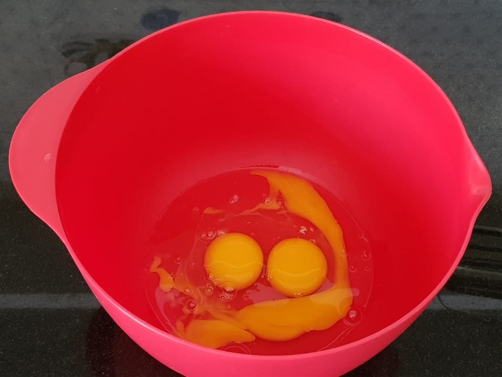 three eggs in a wide bowl
