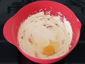 Whisk butter and sugar until it is well combined. Add one egg at a time and beat well.