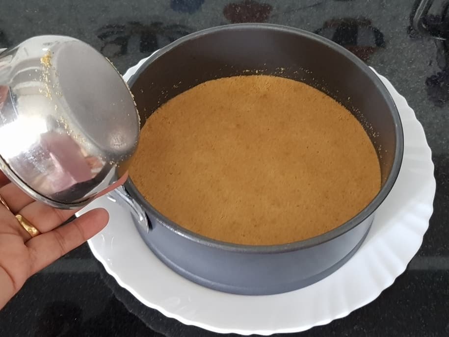 add powdered biscuit mixture in a springform pan and flatten the base and refrigerate for two hours
