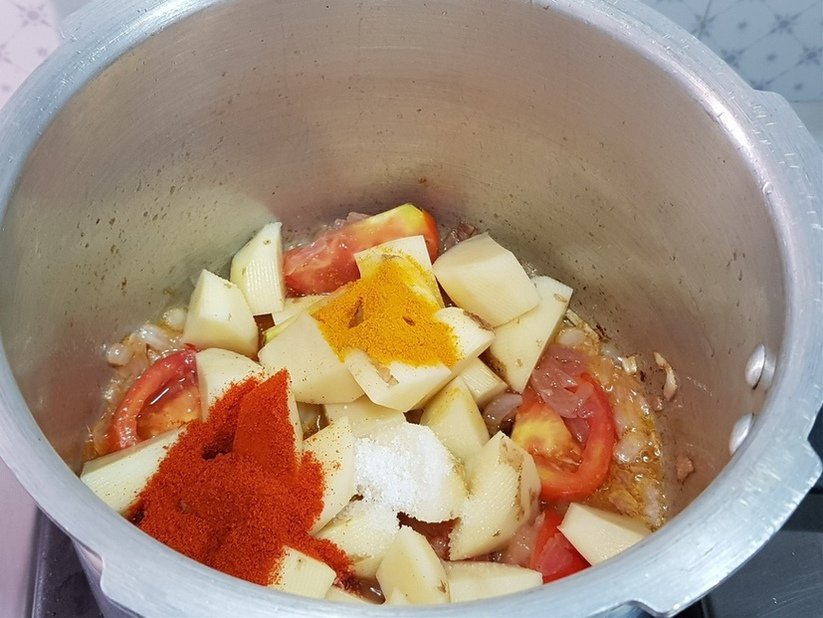 for potato/aloo kurma, add tomato potatoes,chilli powder,turmeric powder and salt to taste