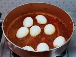 cut egg into halves and add to the egg masala