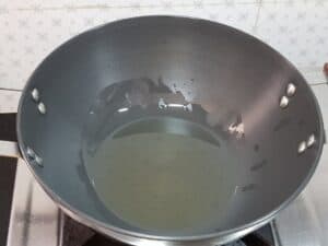 for mango rice heat oil in a wok or kadhai