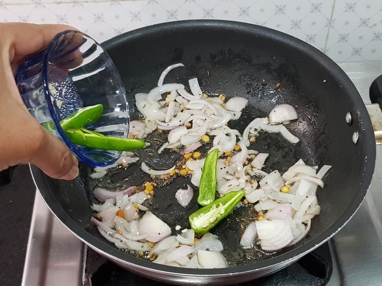 add green chillies and saute for a minute