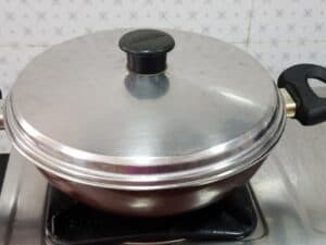 cover with a lid and cook the carrot poriyal