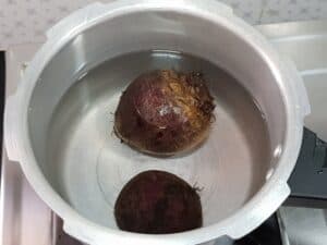 two beetroot in a pressure cooker
