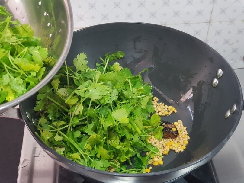 after frying the dals until golden, add kothamalli (coriander ) and sautee for few seconds.