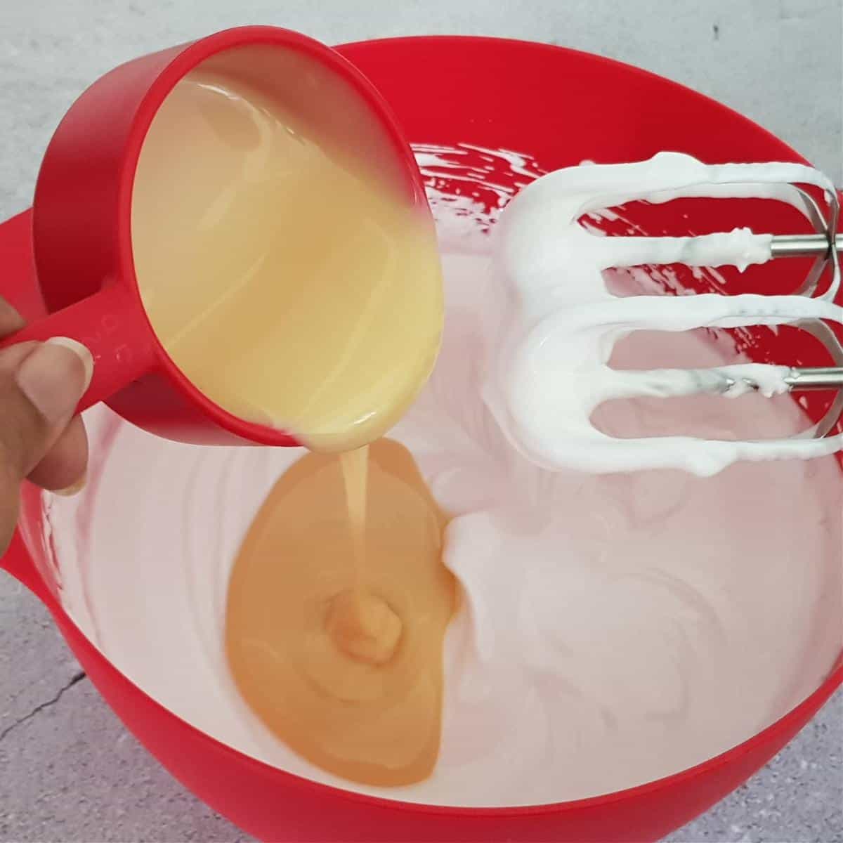 Sweetened condensed milk added to whipped cream.