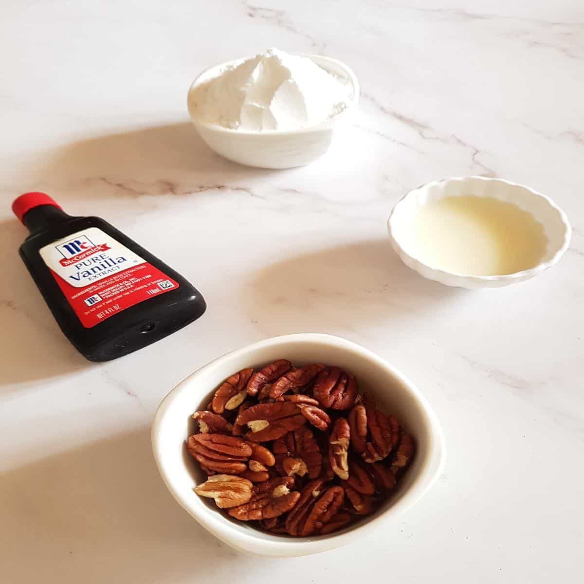 Ingredients for vanilla glaze with powdered sugar, milk and vanilla extract.