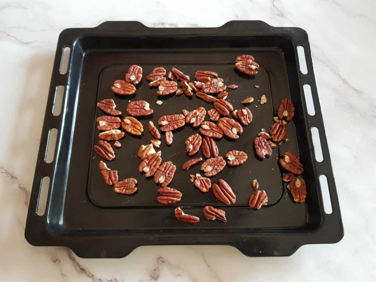 Roast pecans in the oven.