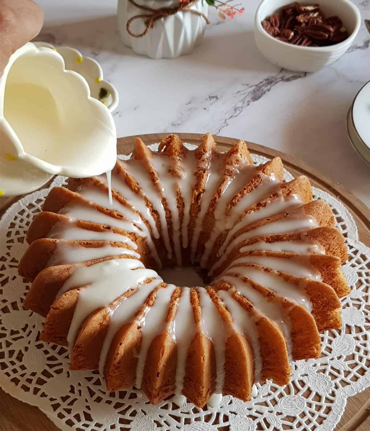 Vanilla glaze drizzled over the cooled banana cake.